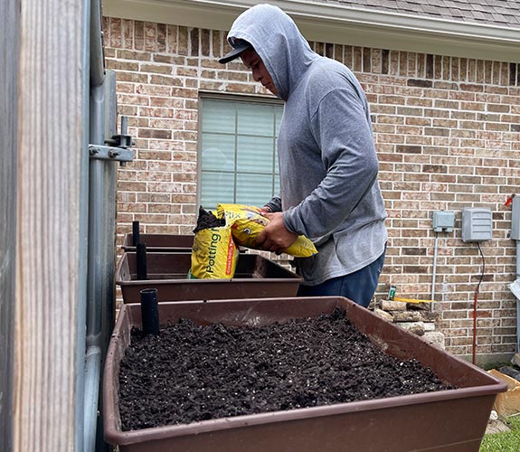 sadding garden soil to containers for container garden